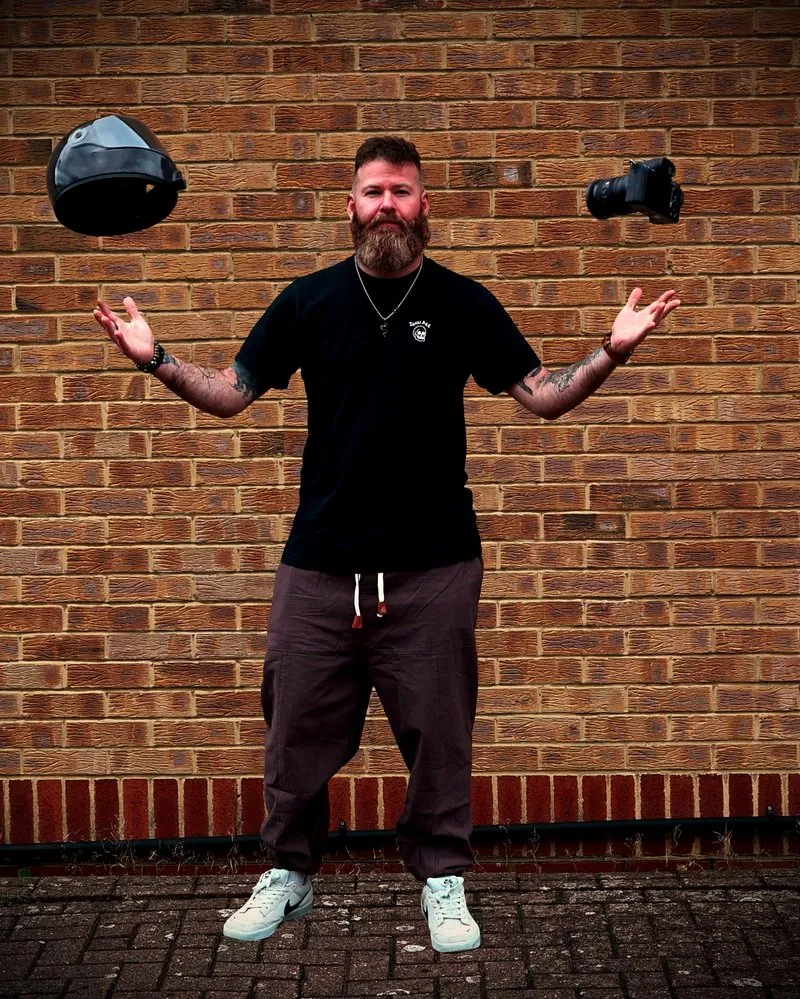DROPTHEORY LAB. creative film production studio profile — London-based cinematic filmmaking, motorcycle filmmaking, action sports and branded content production. Photographer and director in studio setting.